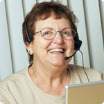 An older woman working as a telephonist.